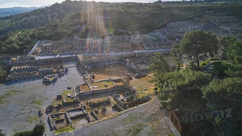 Drone shot, first morning light, backlight, sun rays, ancient ruins in an archaeological site with sun rays, trees and mountains in the background, Kamiros, archaeological site, ancient city, foundation of Doric Greeks, Rhodes, Dodecanese, Greek Islands, Greece, Europe