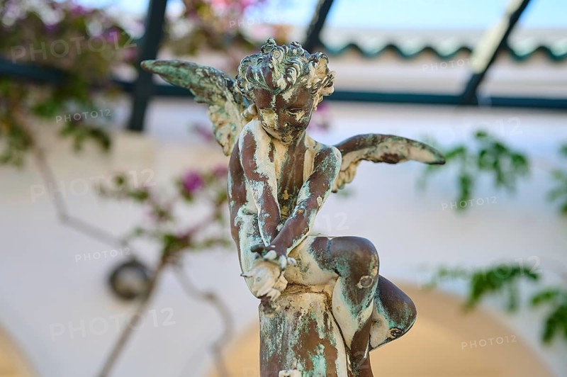 Close-up of an angel statue with weathered patina sitting on a pedestal, thermal springs, thermal baths, thermal baths of Kallithea, Kallithea, Rhodes, Dodecanese, Greek Islands, Greece, Europe