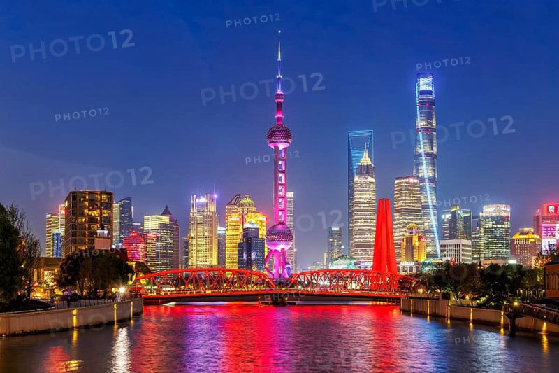 Shanghai skyline at the Bund with Oriental Pearl Tower city centre downtown at night in Shanghai, China, Asia