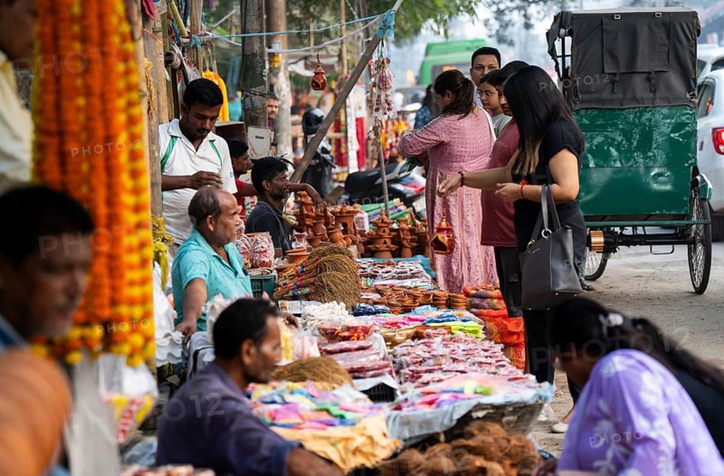 People buy Diya oil lamps and other decorative items at a market on the eve of Diwali, the Hindu festival of lights, in Guwahati, India on October 30, 2024. Diwali, also known as the Festival of Lights, is one of the most widely celebrated Hindu festivals, symbolizing the victory of light over darkness and good over evil