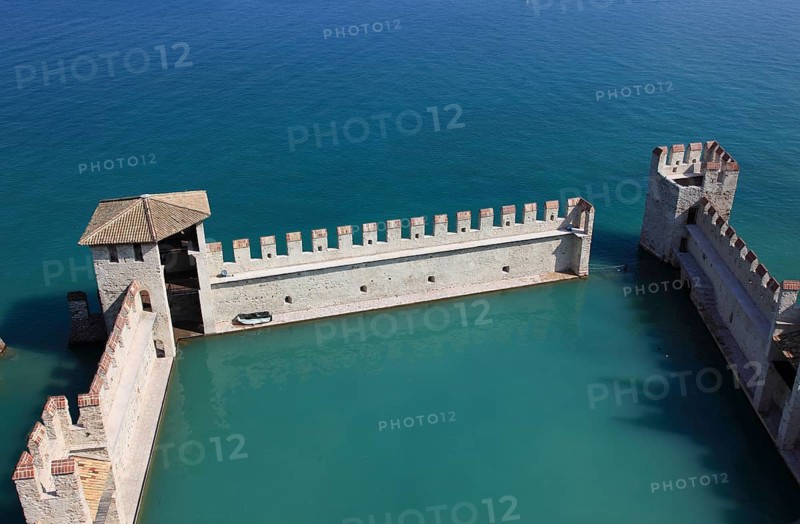 Harbour basin of the castle with flat Guelph battlements, Scaliger Castle, Castello Scaligero, in Sirmione, moated castle on the southern shore of Lake Garda, province of Brescia, Lombardy, Italy, Europe