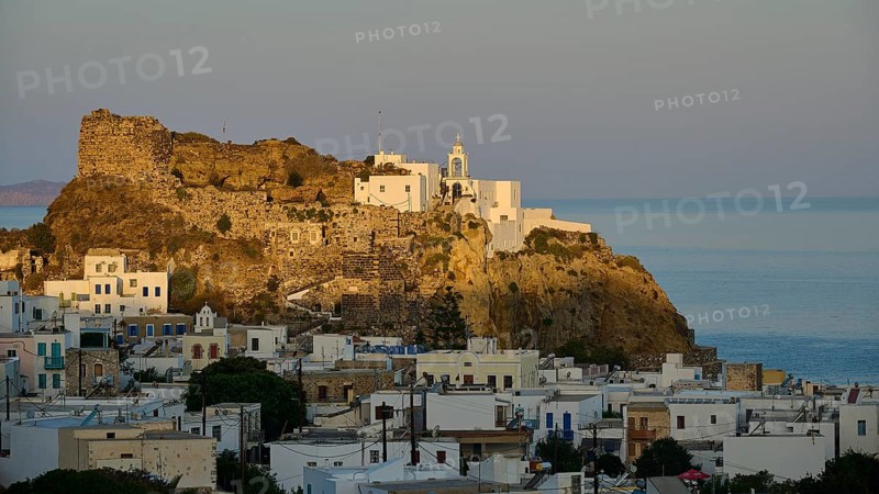 Whitewashed houses and an old castle on a hill at twilight overlooking the calm sea, morning light, Panagia Spiliani, Castle, Mandraki, Nisyros, Dodecanese, Greek Islands, Greece, Europe