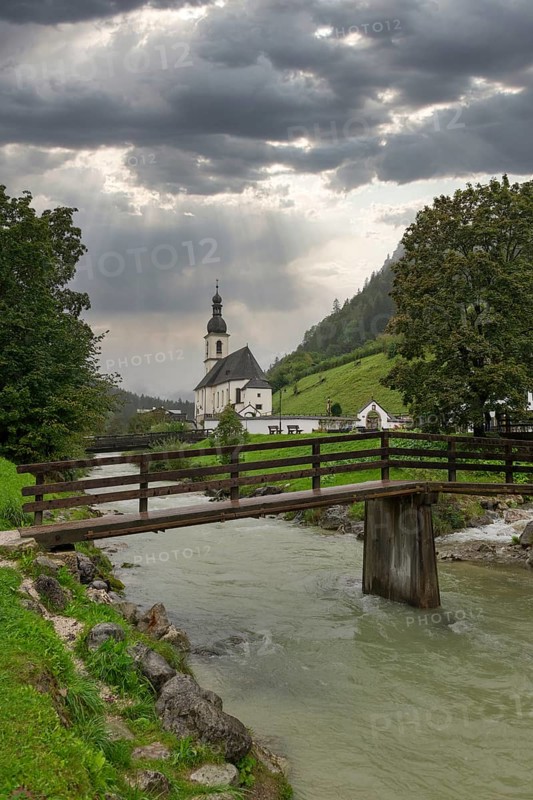 Parish church of St Sebastian, bridge, stream, rainy weather, Ramsauer Ache, Ramsau, Berchtesgadener Land, Upper Bavaria, Bavaria