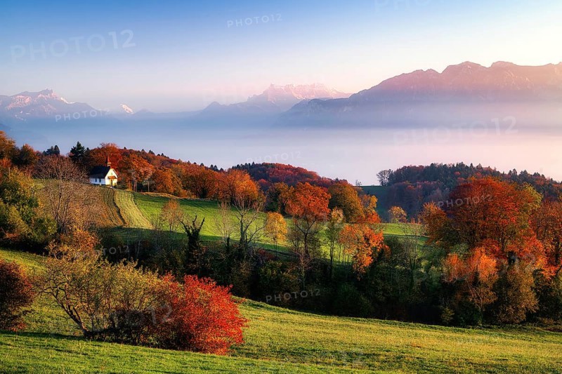 View of Dents du Midi at sunset, fog over Lake Geneva, Vevey, Canton of Vaud, Switzerland, Europe