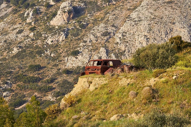 Abandoned rusted car on a rocky meadow in front of majestic mountains, Vehicle wreck, Crete, Greek Islands, Greece, Europe