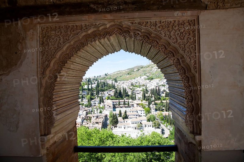 View through Alhambra window archway to Moorish houses in the Albaicin district of Granada, Spain, Europe