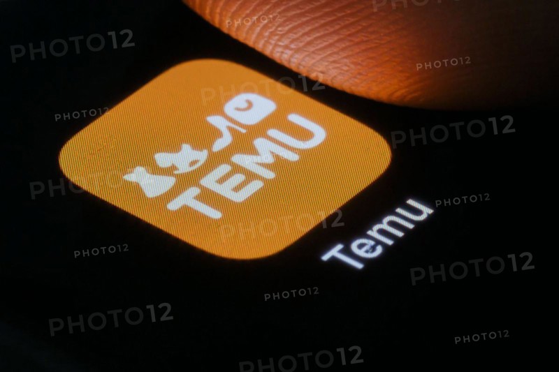 The logo of the Temu app (online marketplace) from Chinese company PDD Holdings can be seen next to a finger. Berlin, 27.03.2024
