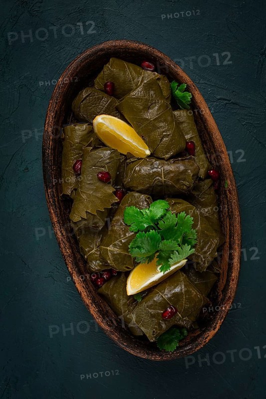 Dolma (Tolma) stuffed rolls, minced meat with rice, in grape leaves, top view, no people, close-up