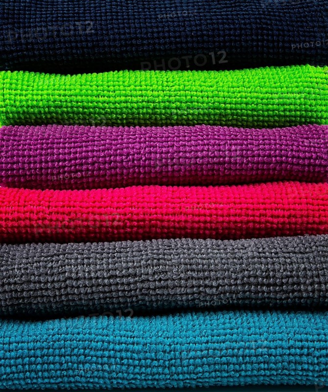 A stack of multicolored, microfiber cloths, for cleaning