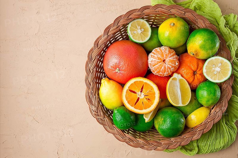Assortment, citrus fruits, in a basket, close-up, top view, no people