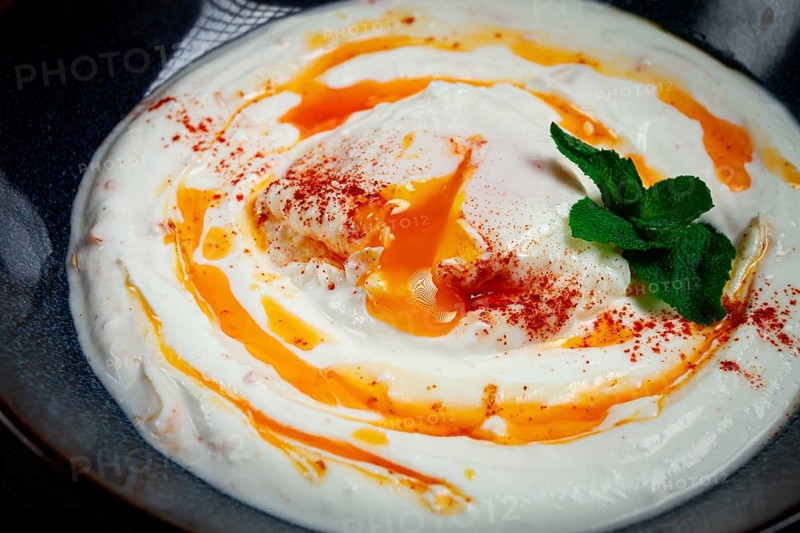 Cilbir, traditional Turkish breakfast, Turkish eggs with yogurt and butter, homemade, no people