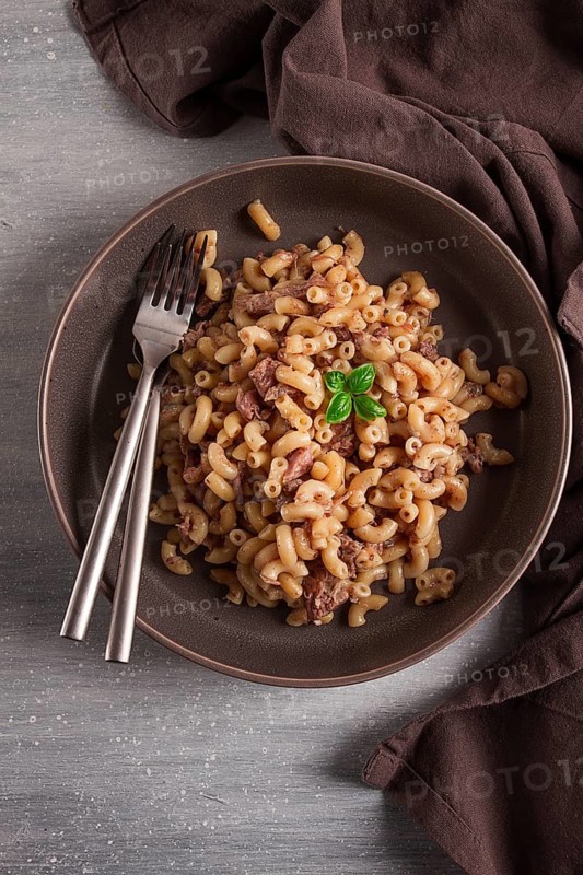 Pasta with stewed meat, pasta in the navy, horns, homemade, no people