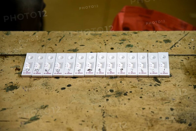 A health worker in personal protective equipment (PPE) arranges test kit after taking nasal swab sample from locals for Covid-19 Rapid Antigen Testing (RAT), at a Swab collection centre ahead of durga puja festival, in Guwahati, India on 21 October 2020. A cumulative total of 9, 72, 00, 379 samples have been tested up to October 20. According to Johns Hopkins University, which has been compiling COVID-19 data from all over the world, India's death toll is the third-worst