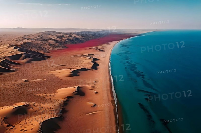 Namib desert from above with deep red dunes meeting the azure atlantik ocean, AI generated