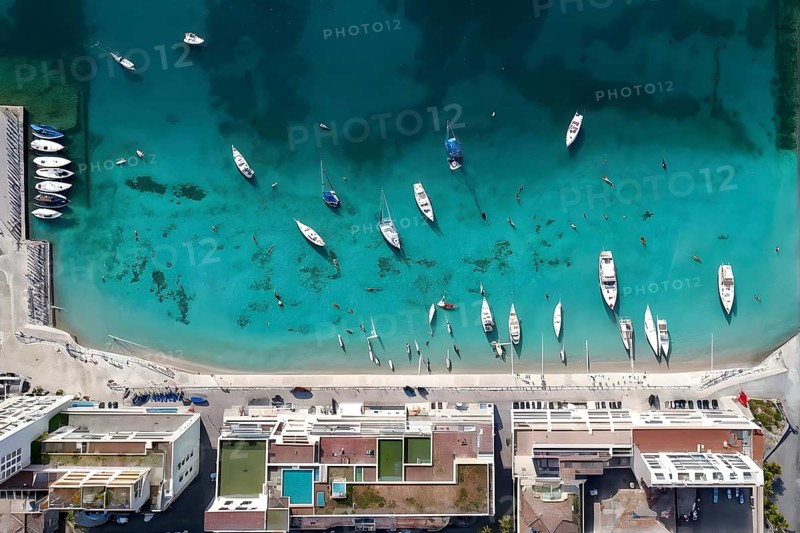 Aerial view of an idyllic harbor landscape with sailboats and yachts, AI generated