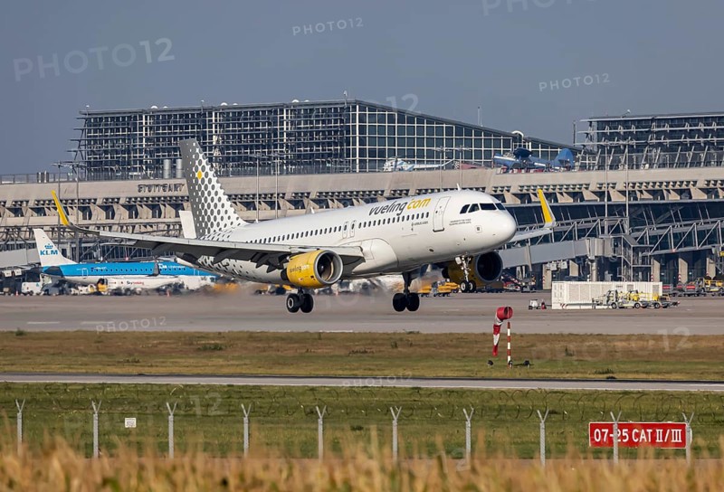 Stuttgart Airport with terminal, aircraft of the airline Vueling landing. Stuttgart, Baden-Württemberg, Germany, Europe