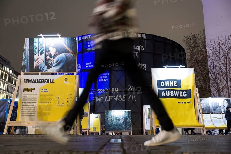 A person crosses the former strip of the Wall in front of the exhibition in front of the asisi Panorama Berlin Die Mauer / The Wall on the 35th anniversary of the fall of the Wall in Berlin, 8 November 2024