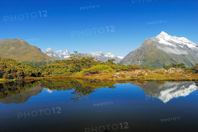 Key Summit with reflection of Mt Christina, Fiordland National Park, World Heritage Site South West New Zealand, West Coast, South Island New Zealand, Fjordland, South Island, New Zealand, Oceania