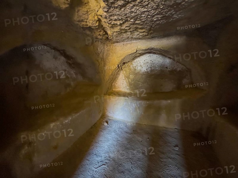 Cave of former Roman necropolis with sandstone caves carved into sandstone Burial caves Cave tombs Grottoes in rocks on the north side of the bay of Matala, in the 60s and 70s Hippie caves Caves for dropouts and hippies Today excursion destination on the south coast of the island of Crete, Matala, Crete, GreeceMatala, Crete, GreeceMatala, Crete, Greece, Europe