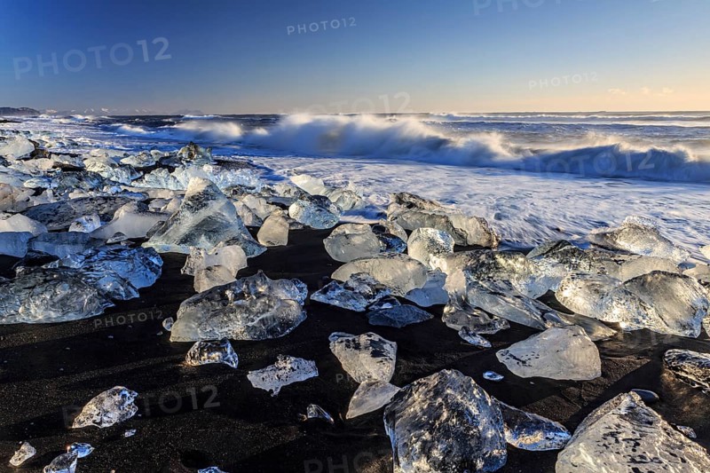 Ice floes on the beach, waves, sea, sunny, morning light, winter, Diamond Beach, Breidamerkursandur, Jökulsarlon, Iceland, Europe