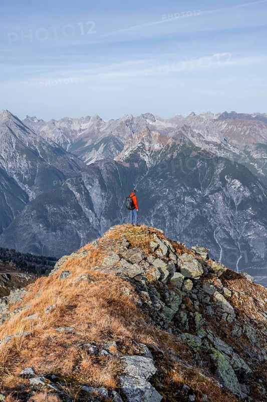 Mountaineers in front of a mountain panorama, view from the ridge of the Venet to mountains of the Parzinn group in the Lechtal Alps, in autumn, Venet crossing, Ötztal Alps, Tyrol, Austria, Europe