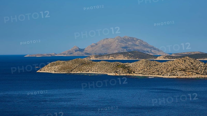 Close to a larger island in the blue sea, surrounded by blue sky and natural landscape, Makri Island, Alimia Island, Chalki Island, Kritinia Castle, St John's Castle, Kritinia, Rhodes, Dodecanese, Greek Islands, Greece, Europe