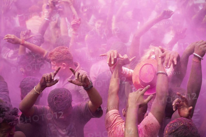 Revellers dancing in the beat of music as they celebrate Holi on a street, the Hindu spring festival of colours on March 25, 2024 in Guwahati, Assam, India. Holi, also known as the Festival of Colors or the Festival of Spring, is one of the most vibrant and joyous festivals in India