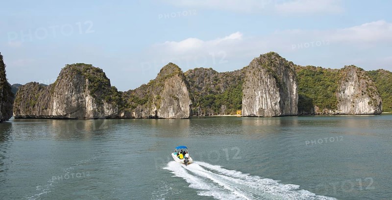 Excursion boat and the karst rocks in Lan Ha Bay, Halong Bay, Vietnam, Asia