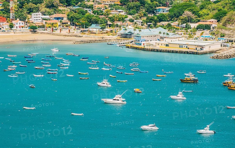 A beautiful bay with yachts and boats on the shore. Boats and yachts in the bay of San Juan del Sur