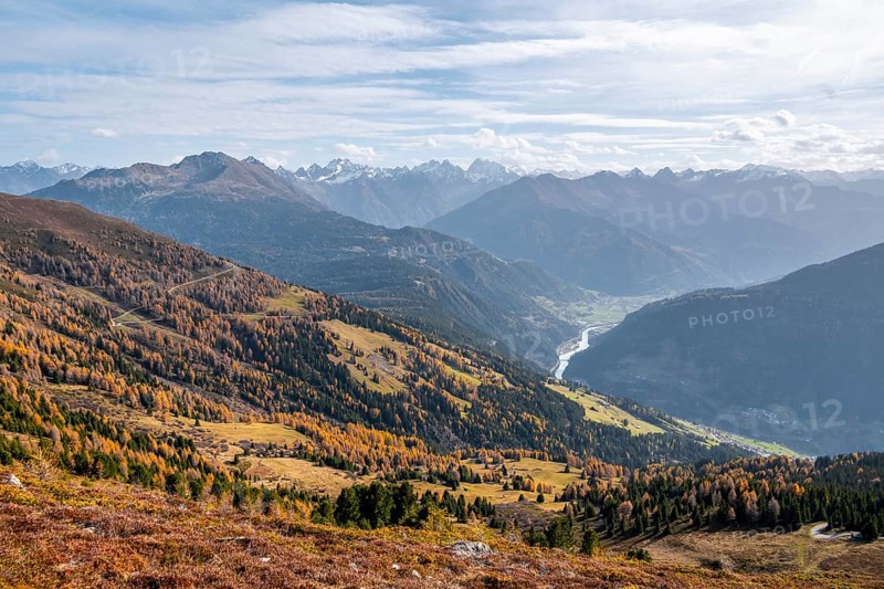 View of the mountain panorama and the Upper Inn Valley in the morning light, Krahberg on the Venet in autumn with yellow larches, Ötztal Alps, Tyrol, Austria, Europe