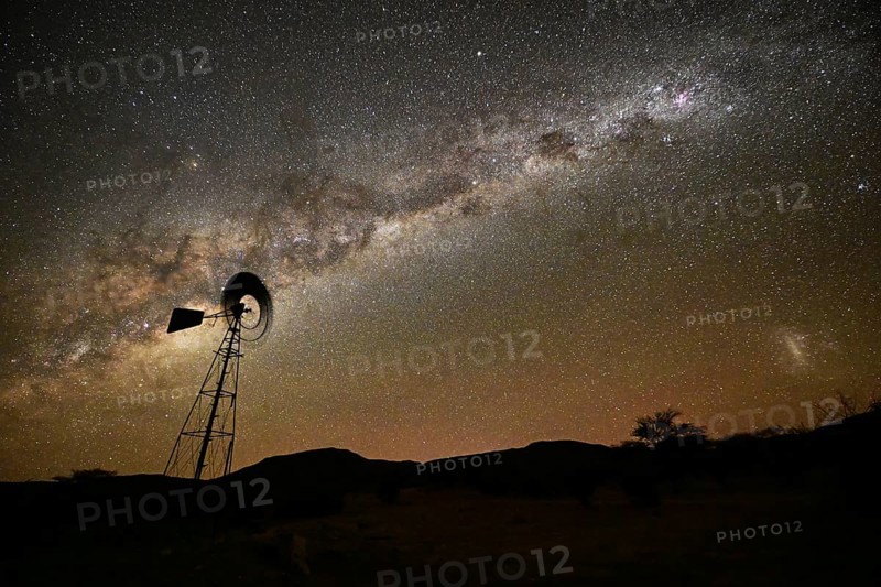 Milky Way over a wind-powered water pump, Namibia, Africa