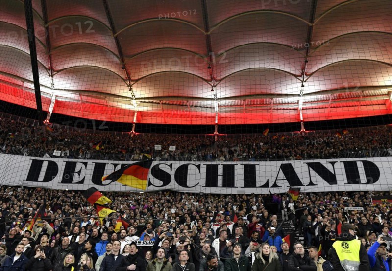 German fans, spectators, singing national anthem, behind banner with lettering GERMANY, national pride, flag, international match Germany GER vs. Netherlands NED, Deutsche Bank Park, stadium, Frankfurt am Main, Hesse, Germany, Europe