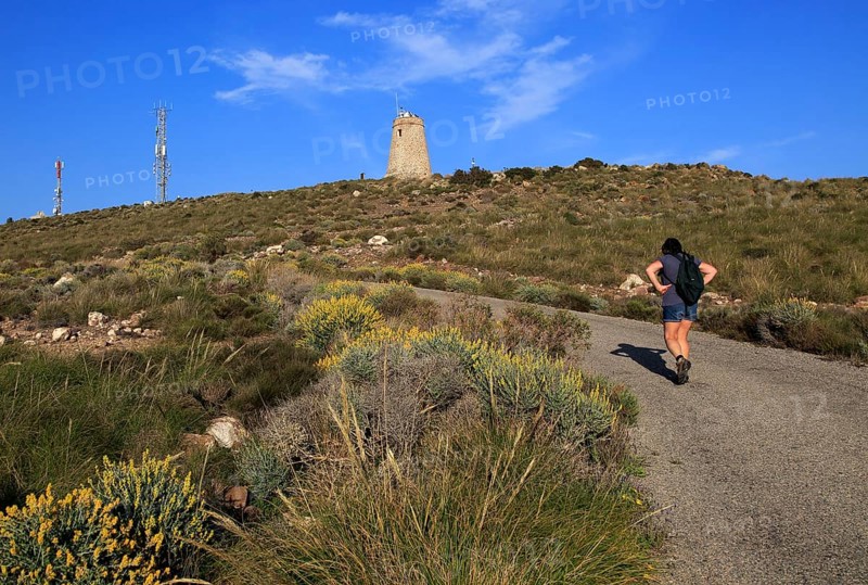 Woman walking Torre Vigia de los Lobos Rodalquilar, Cabo de Gata natural park, Almeria, Spain, Europe