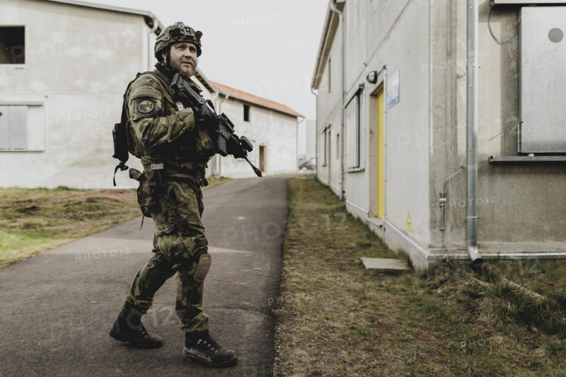 A soldier moves during a simulated house-to-house battle, taken as part of a Bundeswehr exercise with armed forces from Norway and the Czech Republic during the 'Wettiner Schwert' exercise as part of Quadriga 2024 in the training town of Schnöggersburg, 8 April 2024