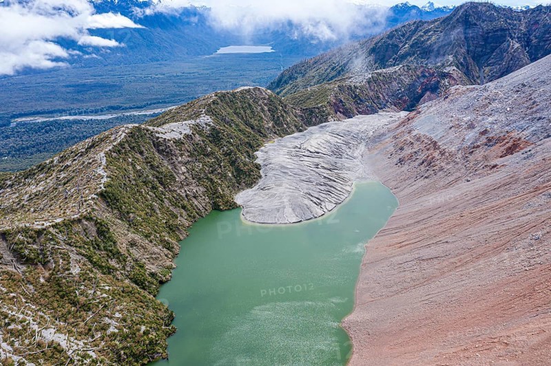Lake with sandbank, dead trees, crater rim of Chaiten volcano, aerial view, Park Pumalin, Patagonia, Chile, South America