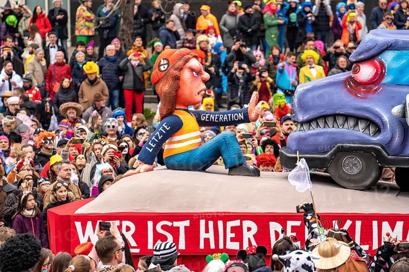 Rose Monday parade in Düsseldorf, street carnival, carnival float, by float builder Jacques Tilly, Last Generation climate activists block a smoking lorry with lignite from Garzweiler
