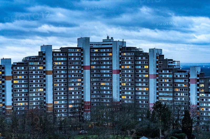 High-rise buildings in the Bensberg residential park, Bergisch-Gladbach, 18-storey housing estate with over 900 flats spread over 7 building complexes, dawn, illuminated windows, North Rhine-Westphalia, Germany, Europe