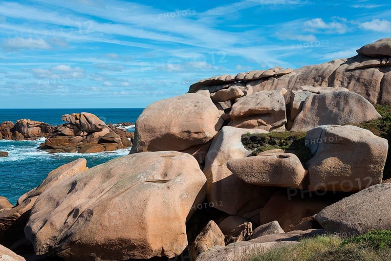 Rock formations on a coastline under a blue sky, Ploumanac'h, Ploumanach, Perros-Guirec, Côtes-d'Armor, Brittany, France, Europe