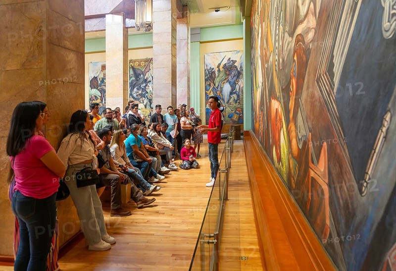 People viewing 'Katharsis' 1934 mural by Jose Clemente Orozco, Palacio de Bellas Artes, Palace of Fine Arts, Mexico City, Mexico, Central America