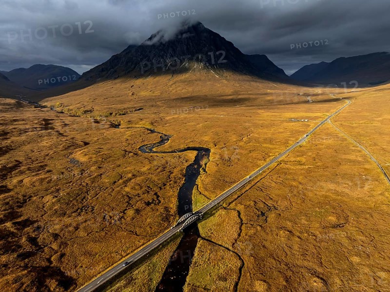 Morning light, cloudy mood, sunbeams, river, moor, mountain landscape, aerial view, road, autumn, view of Buachaille Etive Mòr, Glencoe, Scottish Highlands, Scotland, Great Britain