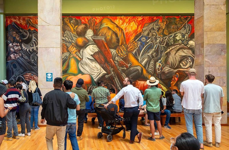 People viewing 'Katharsis' 1934 mural by Jose Clemente Orozco, Palacio de Bellas Artes, Palace of Fine Arts, Mexico City, Mexico, Central America
