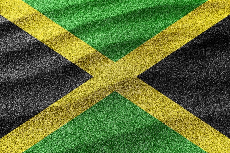 Jamaica sand flag, national flag sand background