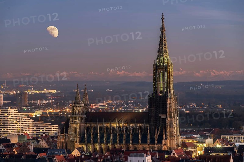Composite of Minster in Ulm with mountain range Alps and full moon