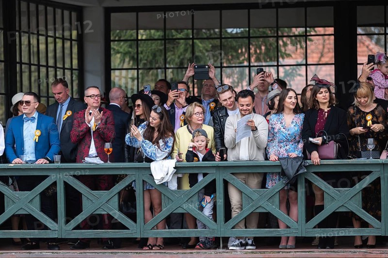 WROCLAW, POLAND - APRIL 23, 2023: Horse racing - opening of the Season at the racecourse WTWK Partynice. People on the VIP tribune.