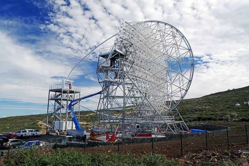 A technical telescope stands in a green landscape under a cloudy sky, Observatory, Roques de los Muchachos, La Palma, Canary Islands, Spain, Europe