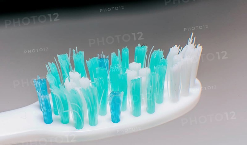 Toothbrush with used bristles. Close up of a used toothbrush