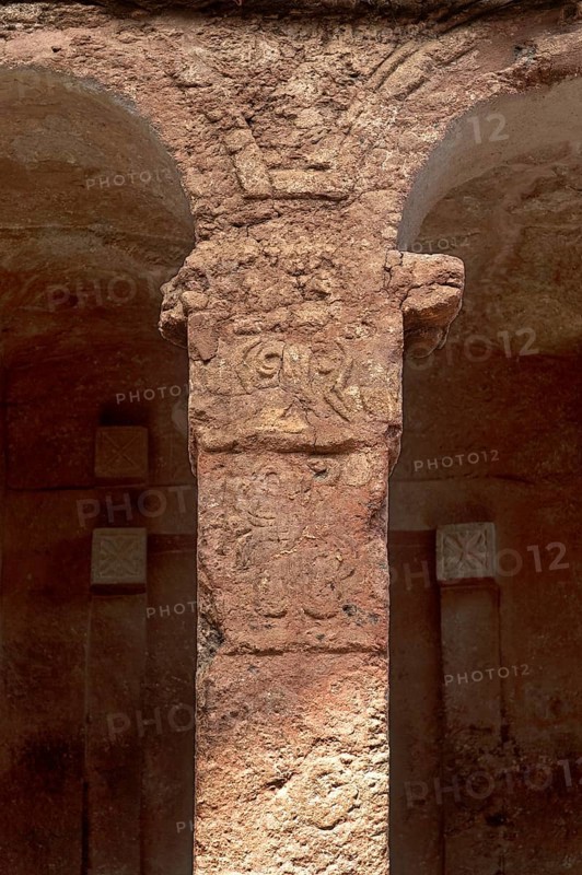 Stone-carved column at the entrance to the monolithic Bete Maryam rock-hewn church, UNESCO World Heritage Site Lalibela, Ethiopia, Africa