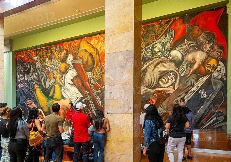 People viewing 'Katharsis' 1934 mural by Jose Clemente Orozco, Palacio de Bellas Artes, Palace of Fine Arts, Mexico City, Mexico, Central America