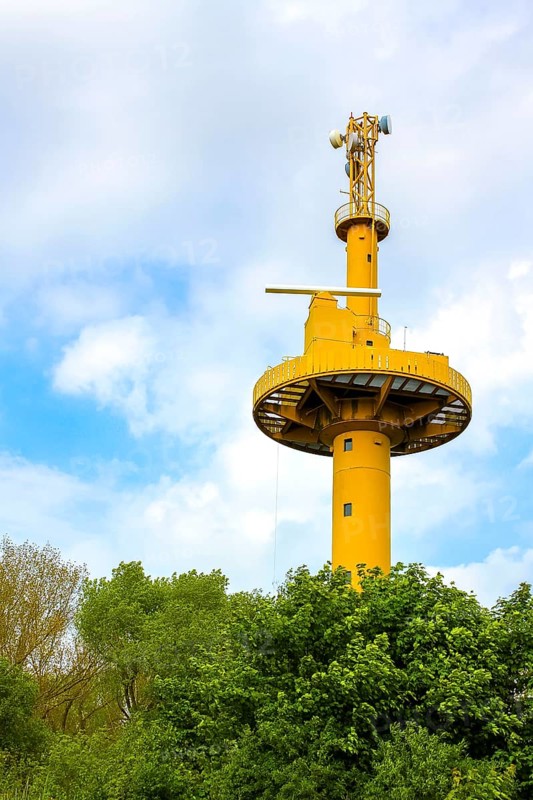 Yellow light house watchtower observation tower in nature on Harrier Sand island in Schwanewede Osterholz Germany