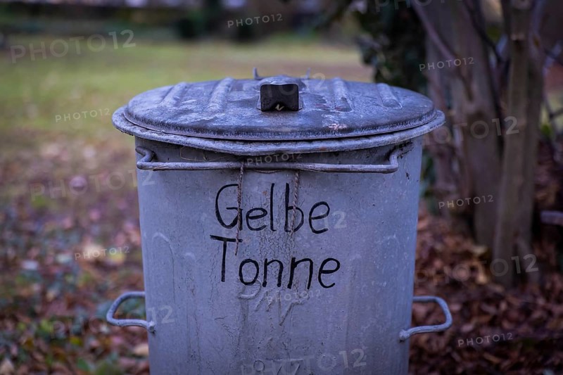 An old GDR rubbish bin has been declared a yellow bin. Possendorf, Saxony, Germany, Europe